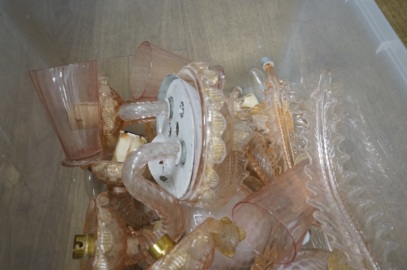 A collection of Murano pink glass wall lights and glasses